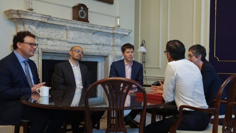 Anthropic CEO Dario Amodei, Google DeepMind CEO Demis Hassabis, and OpenAI CEO Sam Altman convening at global AI summit on cross-agent interoperability
